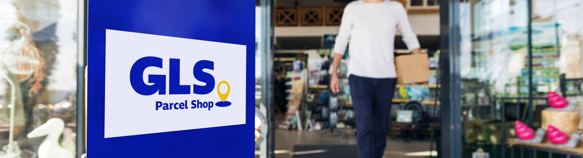 Man leaving a GLS Parcel shop Man leaving a GLS Parcel shop