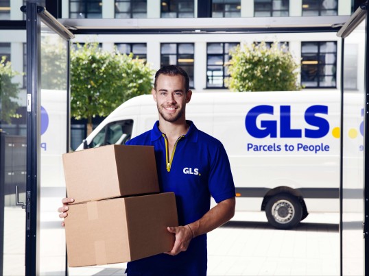 A delivery man unloading his van
