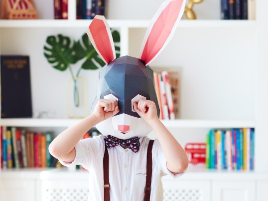 a child with a bunny mask