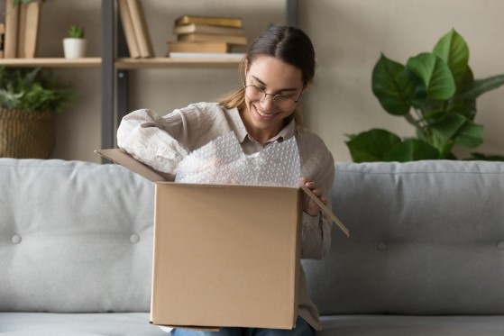 A woman prepares a package